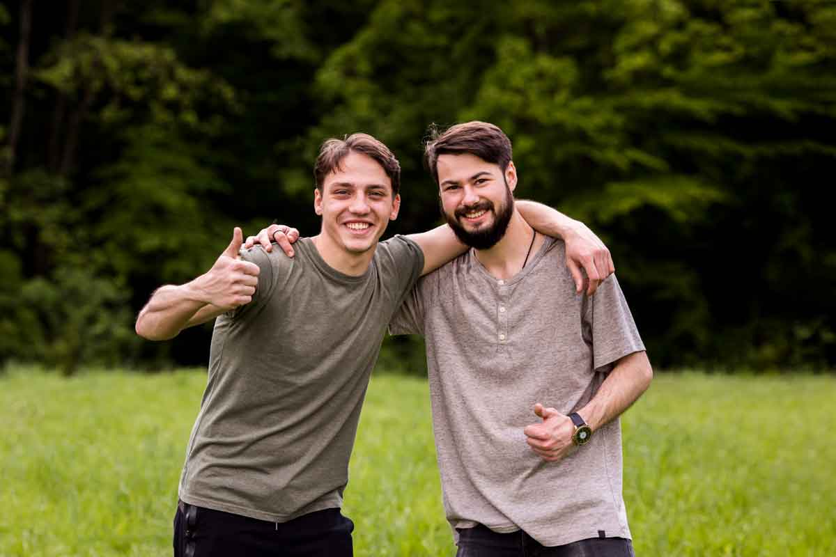 cheerful young men showing excellence sign glade